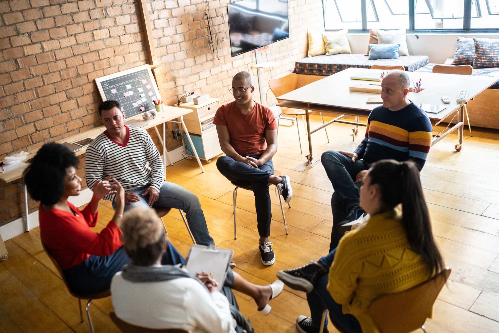 People in a group discussion at a community space