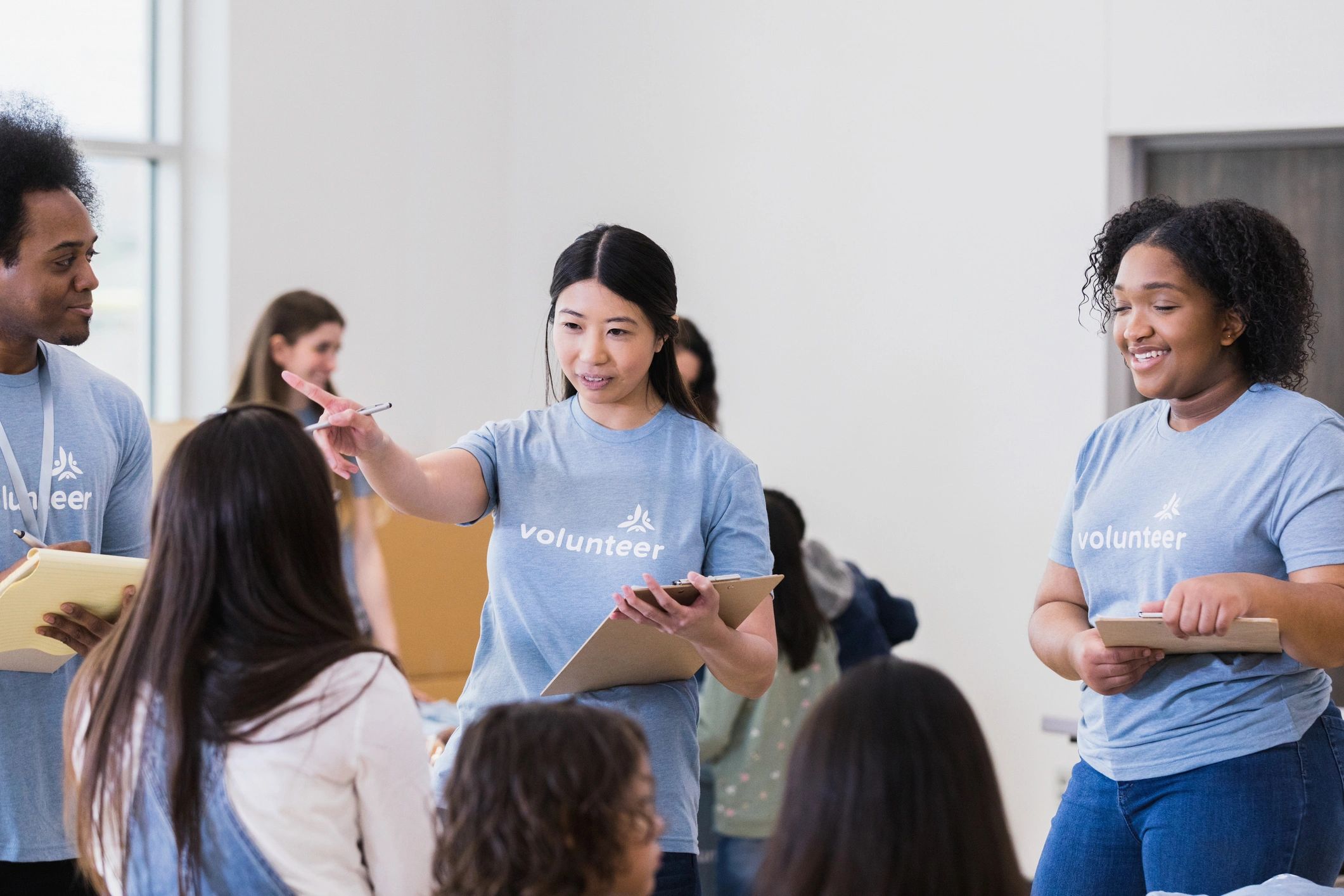 Volunteer coordinator mentoring a pre-teen student