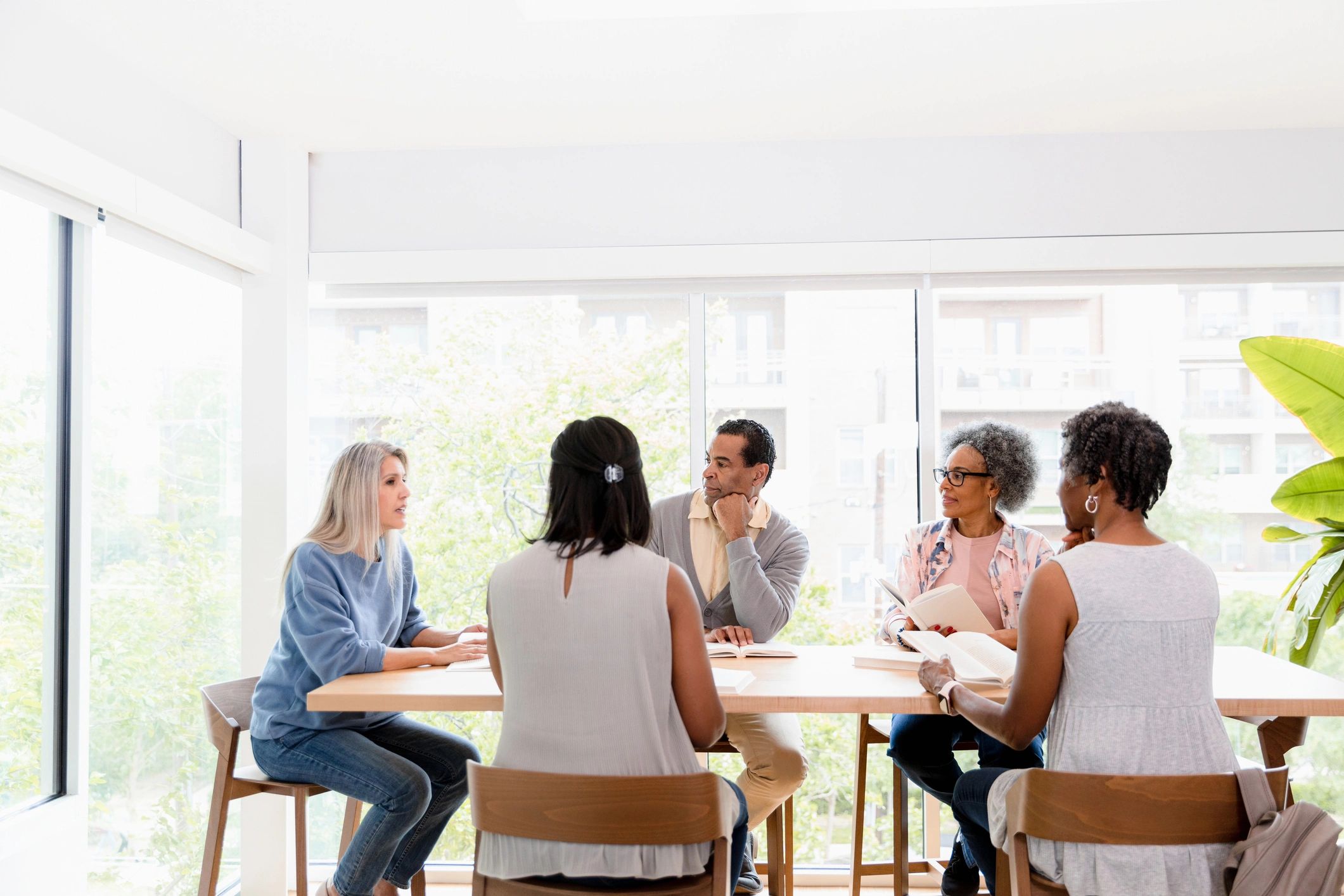 Group discussion around a table during a luncheon meeting