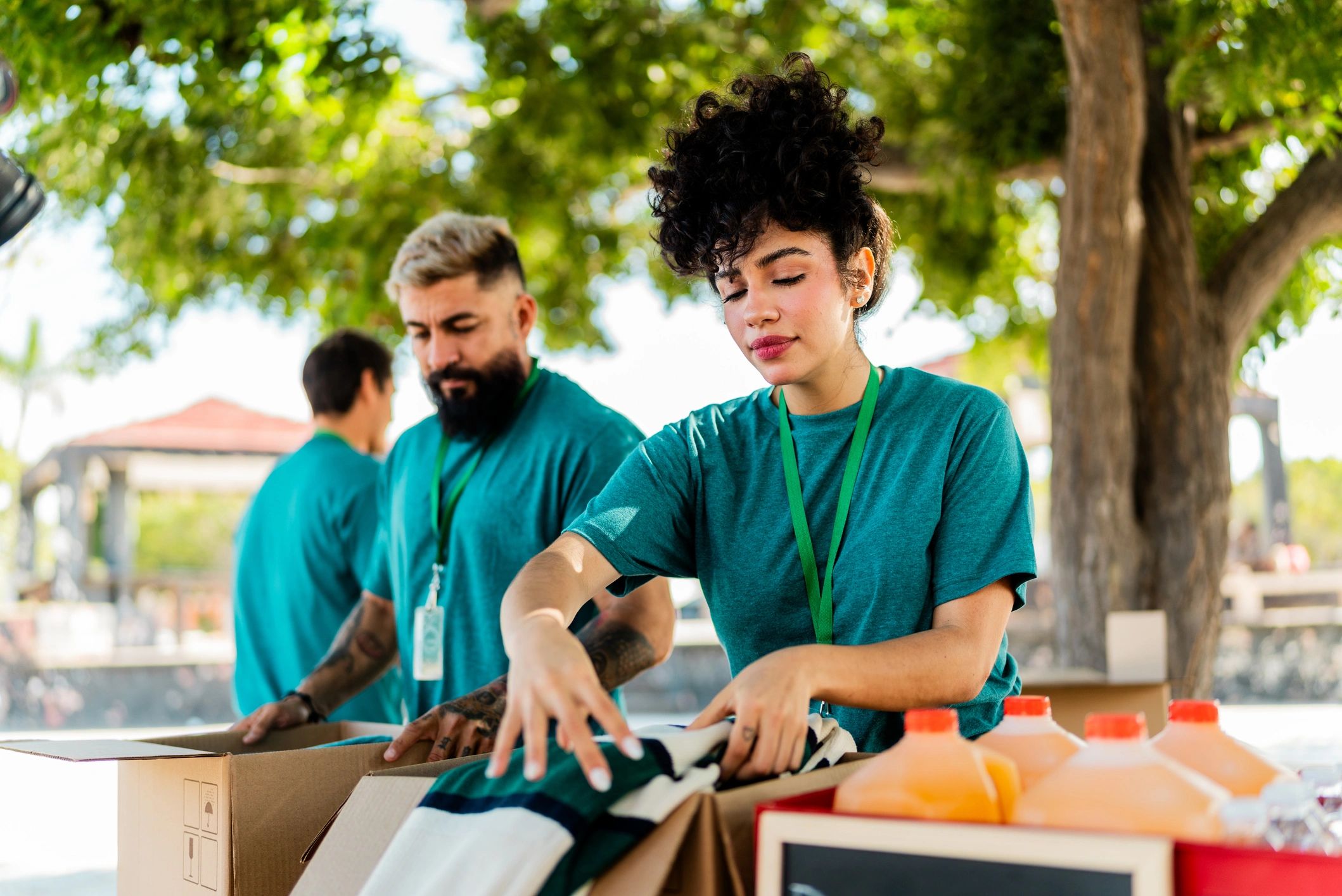 Volunteers organizing donation boxes for a community drive