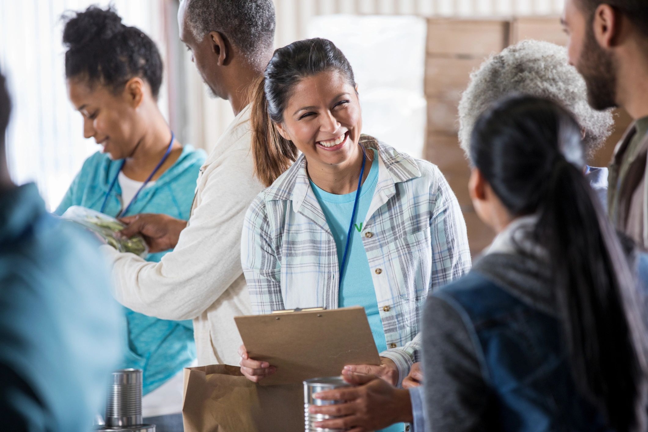 Volunteers collaborating at a food bank sorting donations